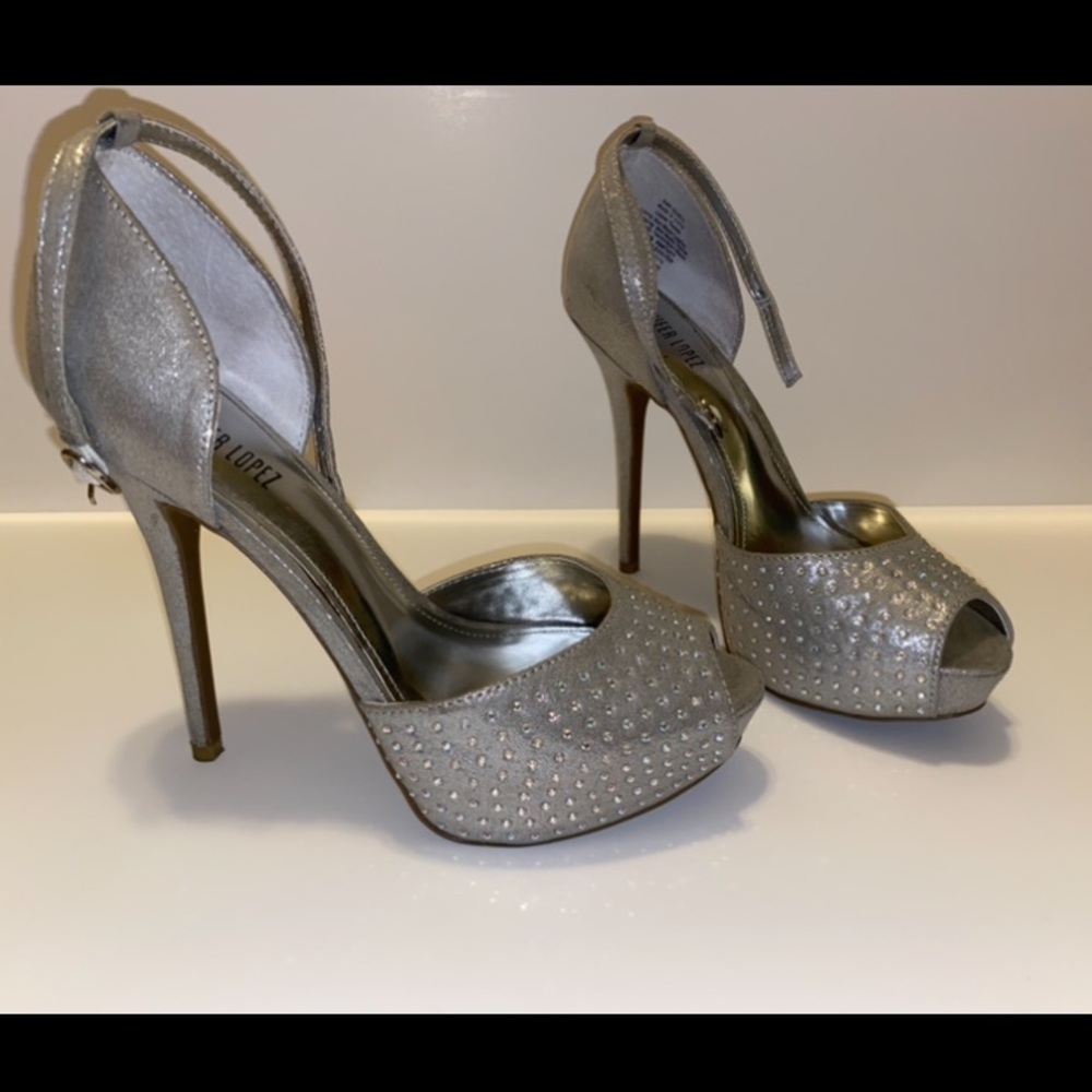 Jennifer Lopez silver high heels.